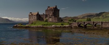 Movie still from “Made of Honor” (2008), directed by Paul Weiland – A castle sits on the edge of a body of water; Extreme Wide shot, Low angle
