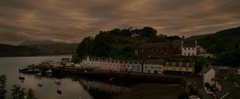 Movie still from “Made of Honor” (2008), directed by Paul Weiland – A row of houses next to a body of water under a cloudy sky; Extreme Wide shot, Low angle