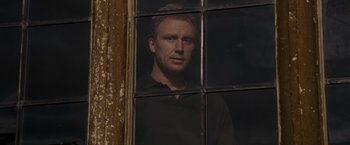 Movie still from “Made of Honor” (2008), directed by Paul Weiland – A man standing in front of an open window; Close Up shot, Over the shoulder angle