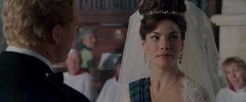 Movie still from “Made of Honor” (2008), directed by Paul Weiland – A woman wearing a tiara and veil in a church; Close Up shot, Over the shoulder angle