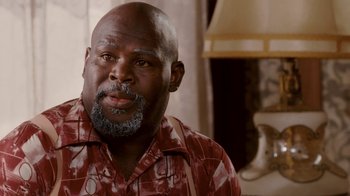 Movie still from “Madea Goes to Jail” (2009), directed by Tyler Perry – A man with a beard and a red and white checkered shirt; Close Up shot, High angle