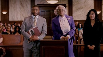 Movie still from “Madea Goes to Jail” (2009), directed by Tyler Perry – A man and a woman standing next to each other in a courtroom; Medium shot, Low angle