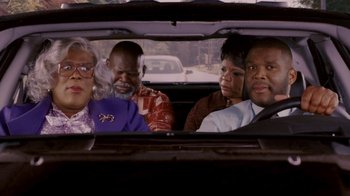 Movie still from “Madea Goes to Jail” (2009), directed by Tyler Perry – A group of people sitting in the back of a car; Medium shot, High angle