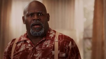 Movie still from “Madea Goes to Jail” (2009), directed by Tyler Perry – An older man with a beard and mustache wearing a red and white shirt; Close Up shot, Low angle