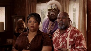 Movie still from “Madea Goes to Jail” (2009), directed by Tyler Perry – A group of people standing next to each other in a room; Medium shot, Low angle