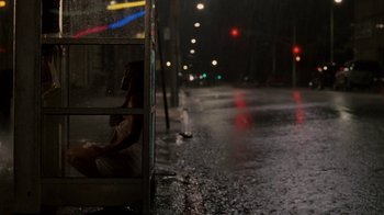 Movie still from “Madea Goes to Jail” (2009), directed by Tyler Perry – A woman sitting on a bus on a rainy night; Wide shot, Low angle