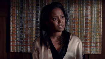 Movie still from “Madea Goes to Jail” (2009), directed by Tyler Perry – A woman with long black hair wearing a black and white shirt; Close Up shot, Low angle