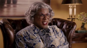 Movie still from “Madea Goes to Jail” (2009), directed by Tyler Perry – A madea character sitting on a chair; Close Up shot, High angle