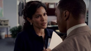 Movie still from “Madea Goes to Jail” (2009), directed by Tyler Perry – A woman holding a piece of paper talking to a man; Close Up shot, Over the shoulder angle