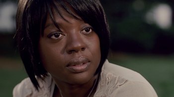 Movie still from “Madea Goes to Jail” (2009), directed by Tyler Perry – A person with short black hair; Close Up shot, Over the shoulder angle