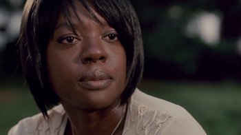 Movie still from “Madea Goes to Jail” (2009), directed by Tyler Perry – A person with short black hair; Close Up shot, Over the shoulder angle