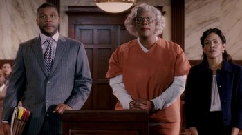 Movie still from “Madea Goes to Jail” (2009), directed by Tyler Perry – A man standing in front of a judge in a courtroom; Medium shot, Low angle