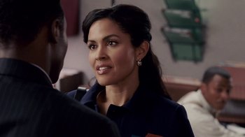 Movie still from “Madea Goes to Jail” (2009), directed by Tyler Perry – A person wearing a suit and tie; Close Up shot, Over the shoulder angle