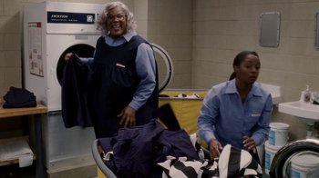 Movie still from “Madea Goes to Jail” (2009), directed by Tyler Perry – Two women are working in a laundromat together; Medium shot, High angle
