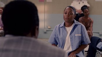 Movie still from “Madea Goes to Jail” (2009), directed by Tyler Perry – A woman sitting in front of a man in a room; Medium shot, Over the shoulder angle