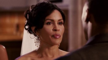 Movie still from “Madea Goes to Jail” (2009), directed by Tyler Perry – A person wearing a dress; Close Up shot, Over the shoulder angle