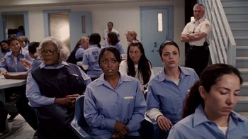 Movie still from “Madea Goes to Jail” (2009), directed by Tyler Perry – A group of people sitting in a room; Medium shot, Over the shoulder angle