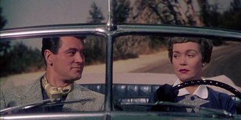 Movie still from “Magnificent Obsession” (1954), directed by Douglas Sirk – Two men sitting in the back seat of a car; Medium shot, Low angle