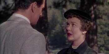 Movie still from “Magnificent Obsession” (1954), directed by Douglas Sirk – A man and a woman are talking to each other; Close Up shot, Over the shoulder angle
