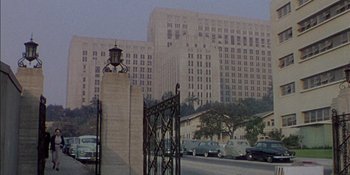 Movie still from “Magnificent Obsession” (1954), directed by Douglas Sirk – A view of a building from across the street; Extreme Wide shot, High angle
