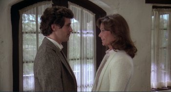 Movie still from “Making Love” (1982), directed by Arthur Hiller – A man and a woman standing next to each other; Close Up shot, Over the shoulder angle