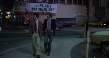 Movie still from “Making Love” (1982), directed by Arthur Hiller – Two men walking down a street at night; Wide shot, Low angle