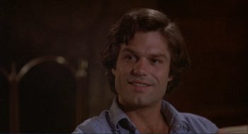 Movie still from “Making Love” (1982), directed by Arthur Hiller – A person with long hair; Close Up shot, High angle