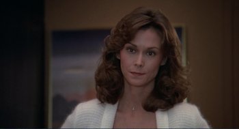 Movie still from “Making Love” (1982), directed by Arthur Hiller – A person with long hair; Close Up shot, Low angle