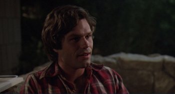 Movie still from “Making Love” (1982), directed by Arthur Hiller – A person wearing a plaid shirt; Close Up shot, High angle