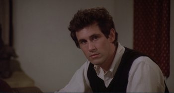 Movie still from “Making Love” (1982), directed by Arthur Hiller – A person sitting in a room; Close Up shot, High angle