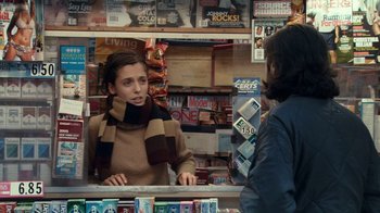 Movie still from “Man Push Cart” (2005), directed by Ramin Bahrani – A woman is talking to a woman in a store; Medium shot, Over the shoulder angle