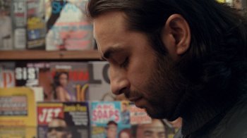 Movie still from “Man Push Cart” (2005), directed by Ramin Bahrani – A person looking down at his face; Close Up shot, Low angle