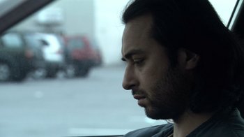 Movie still from “Man Push Cart” (2005), directed by Ramin Bahrani – A person in a car; Close Up shot, Low angle