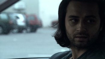 Movie still from “Man Push Cart” (2005), directed by Ramin Bahrani – A person with long hair; Close Up shot, Over the shoulder angle