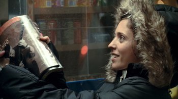 Movie still from “Man Push Cart” (2005), directed by Ramin Bahrani – A woman in a black jacket holding a bottle of wine; Close Up shot, Over the shoulder angle