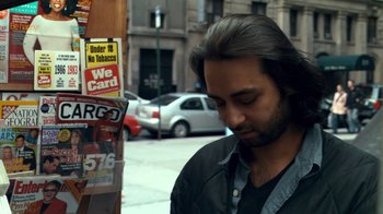 Movie still from “Man Push Cart” (2005), directed by Ramin Bahrani – A man standing in front of a store window; Close Up shot, Over the shoulder angle