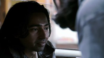 Movie still from “Man Push Cart” (2005), directed by Ramin Bahrani – A person sitting in a car; Close Up shot, Over the shoulder angle