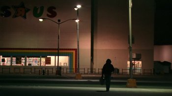 Movie still from “Man Push Cart” (2005), directed by Ramin Bahrani – A person walking on the street at night; Extreme Wide shot, Low angle