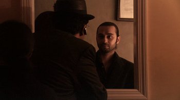 Movie still from “Man Push Cart” (2005), directed by Ramin Bahrani – A man looking at himself in the mirror; Close Up shot, Over the shoulder angle