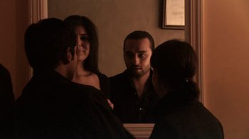 Movie still from “Man Push Cart” (2005), directed by Ramin Bahrani – A man and a woman looking in a mirror; Close Up shot, Over the shoulder angle