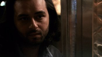 Movie still from “Man Push Cart” (2005), directed by Ramin Bahrani – A person with long black hair; Close Up shot, Low angle