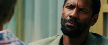 Movie still from “Man on Fire” (2004), directed by Tony Scott – A person with a beard; Close Up shot, Over the shoulder angle