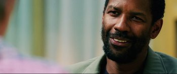 Movie still from “Man on Fire” (2004), directed by Tony Scott – A person with a beard; Close Up shot, Over the shoulder angle