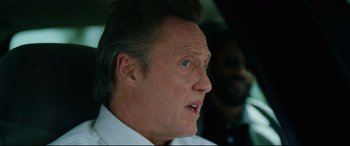 Movie still from “Man on Fire” (2004), directed by Tony Scott – A person wearing a white shirt; Close Up shot, Over the shoulder angle