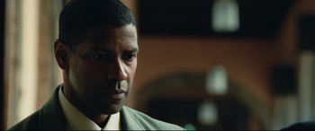 Movie still from “Man on Fire” (2004), directed by Tony Scott – A person wearing a shirt and tie; Close Up shot, Low angle