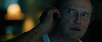 Movie still from “Man on Fire” (2004), directed by Tony Scott – An older man talking on a cell phone; Close Up shot, Low angle