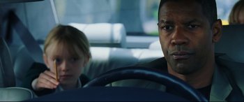 Movie still from “Man on Fire” (2004), directed by Tony Scott – A man and a child in a car; Close Up shot, Over the shoulder angle