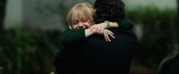 Movie still from “Man on Fire” (2004), directed by Tony Scott – A man and a woman hugging each other; Close Up shot, Over the shoulder angle