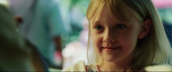 Movie still from “Man on Fire” (2004), directed by Tony Scott – A young girl smiling for the camera; Close Up shot, Over the shoulder angle