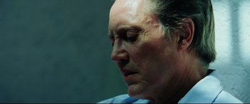 Movie still from “Man on Fire” (2004), directed by Tony Scott – An older woman is looking down at her face; Close Up shot, Low angle